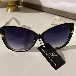 Louis Vuitton Sunglasses. Drawstring bag included.